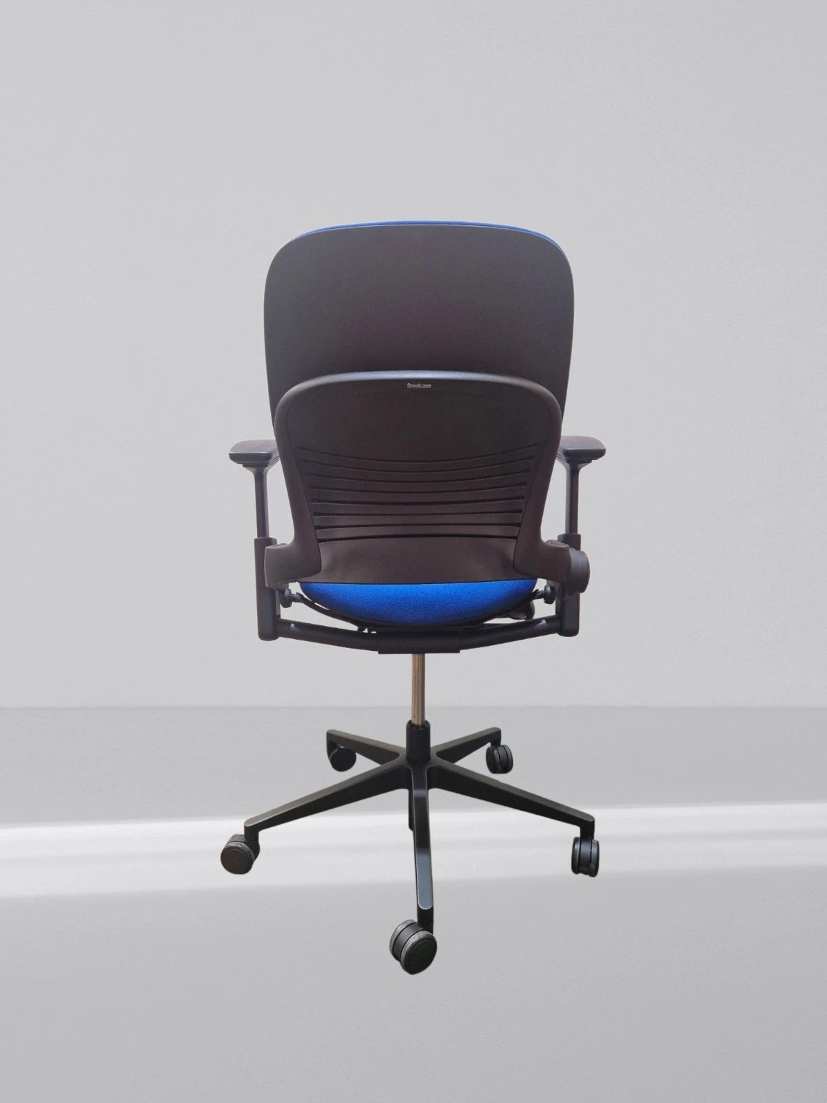 Steelcase leap v2 height adjustable arm in new blue fabric